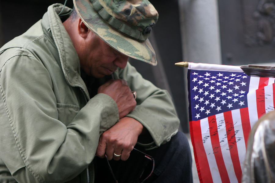 veteran near U.S. flag
