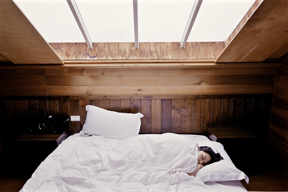 Woman sleeps in wooden cabin