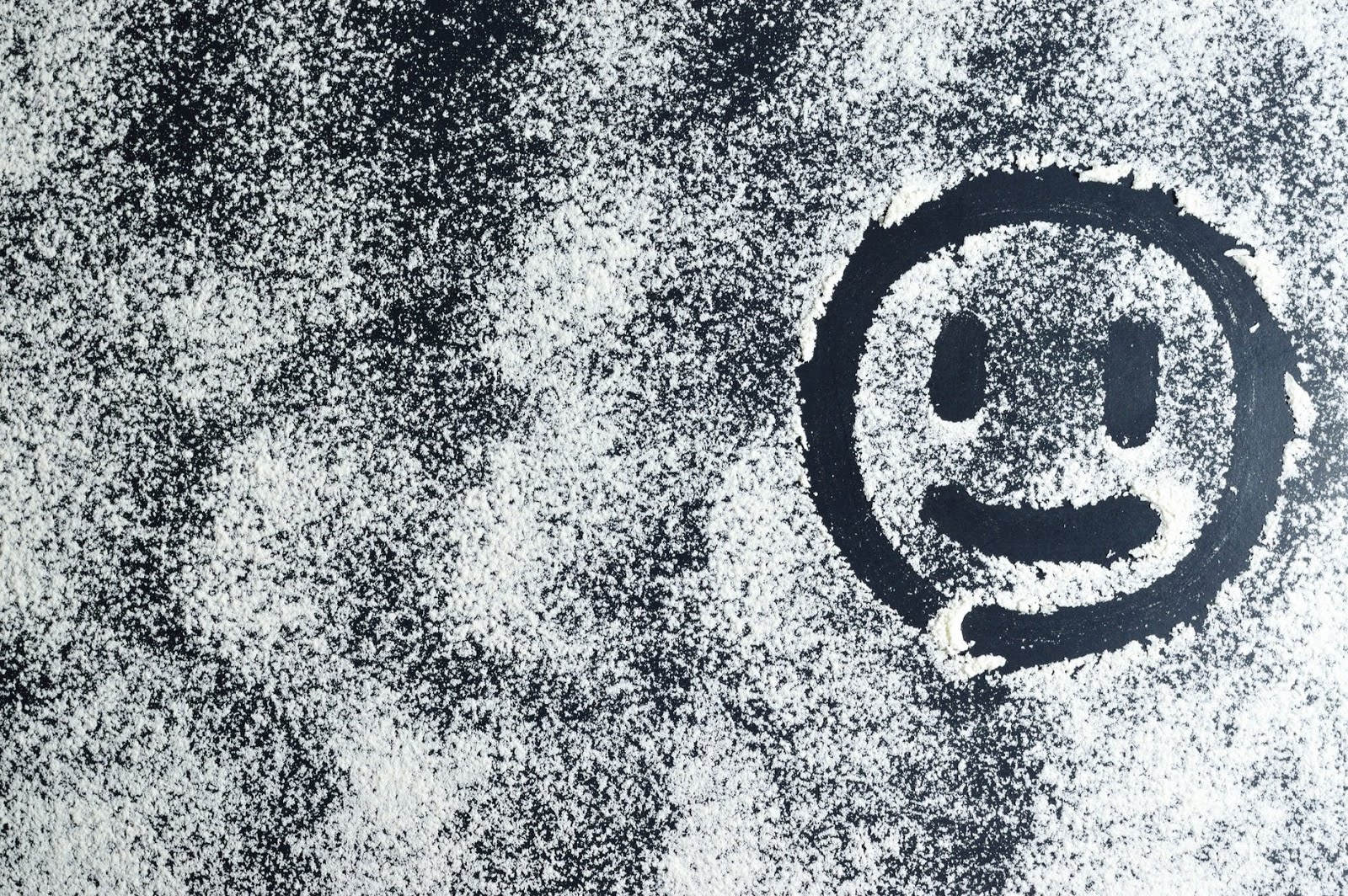 Smiley face on window drawn in the snow