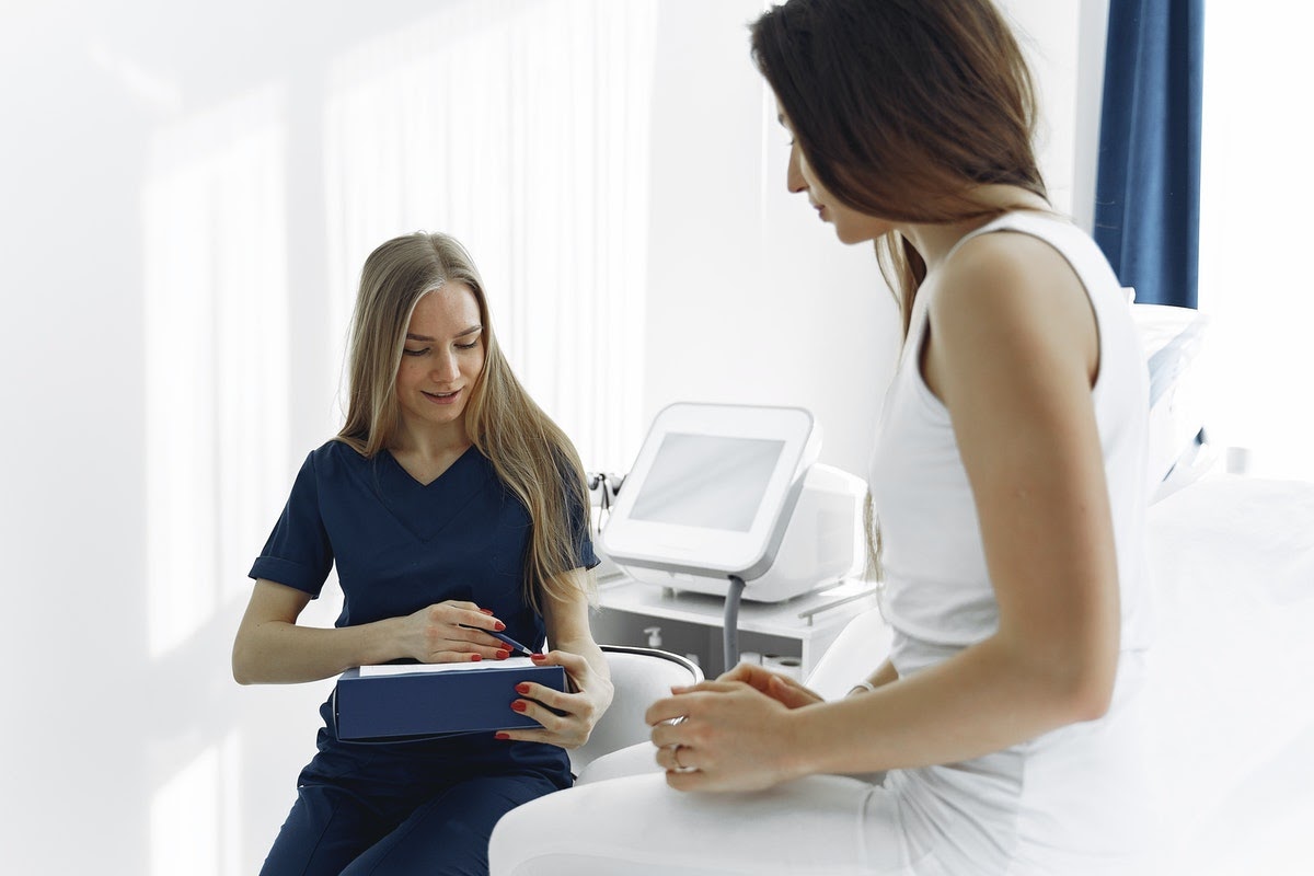 A healthcare worker talks to her patient about potential treatments. As a depression patient, the goal is to not have to go through too many trials of treatments before finding one that works.