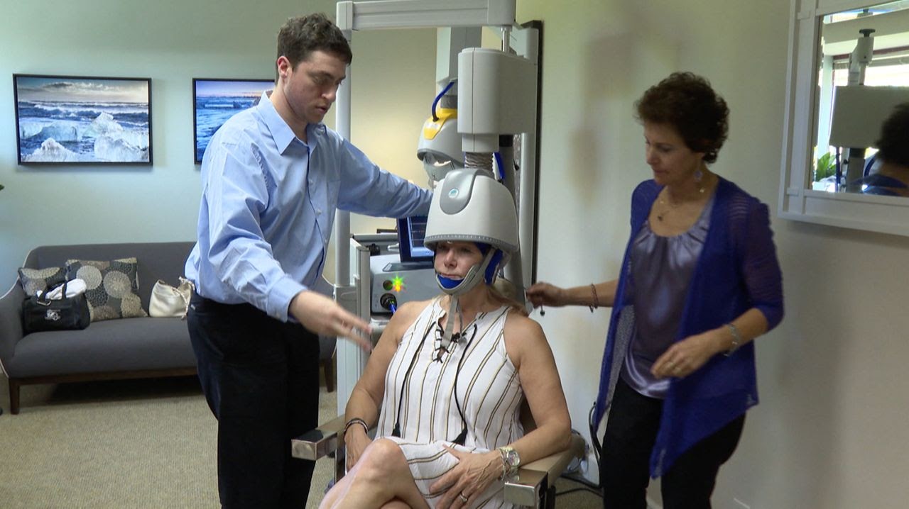 Woman preparing to receive TMS treatment for PTSD