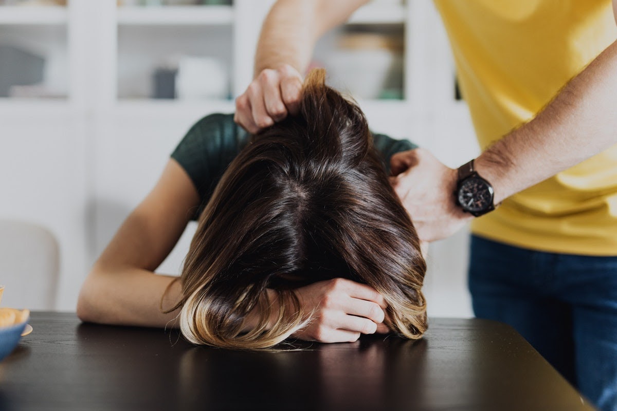 Man soothing woman with adjustment disorder