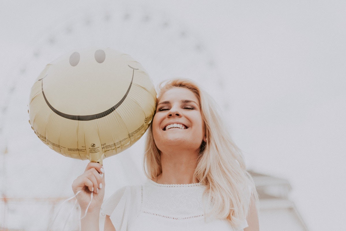 Woman smiling after going through TMS treatment
