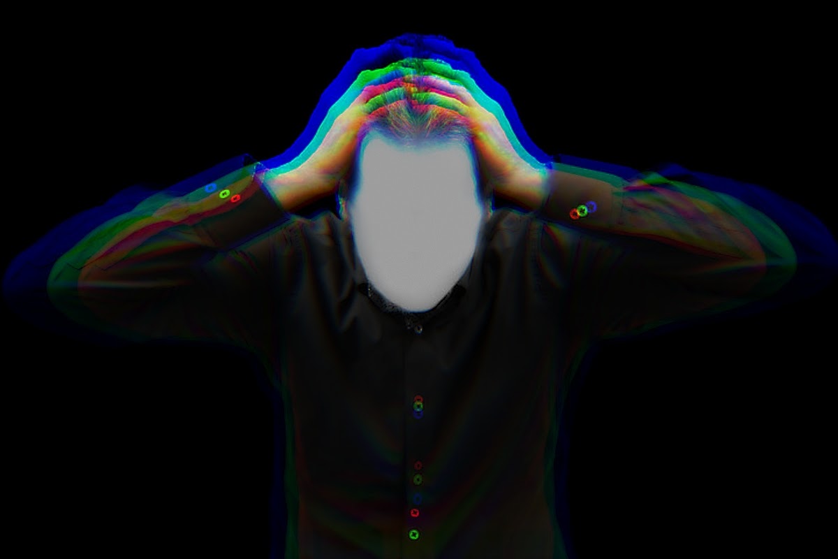 man grabbing head in frustration
