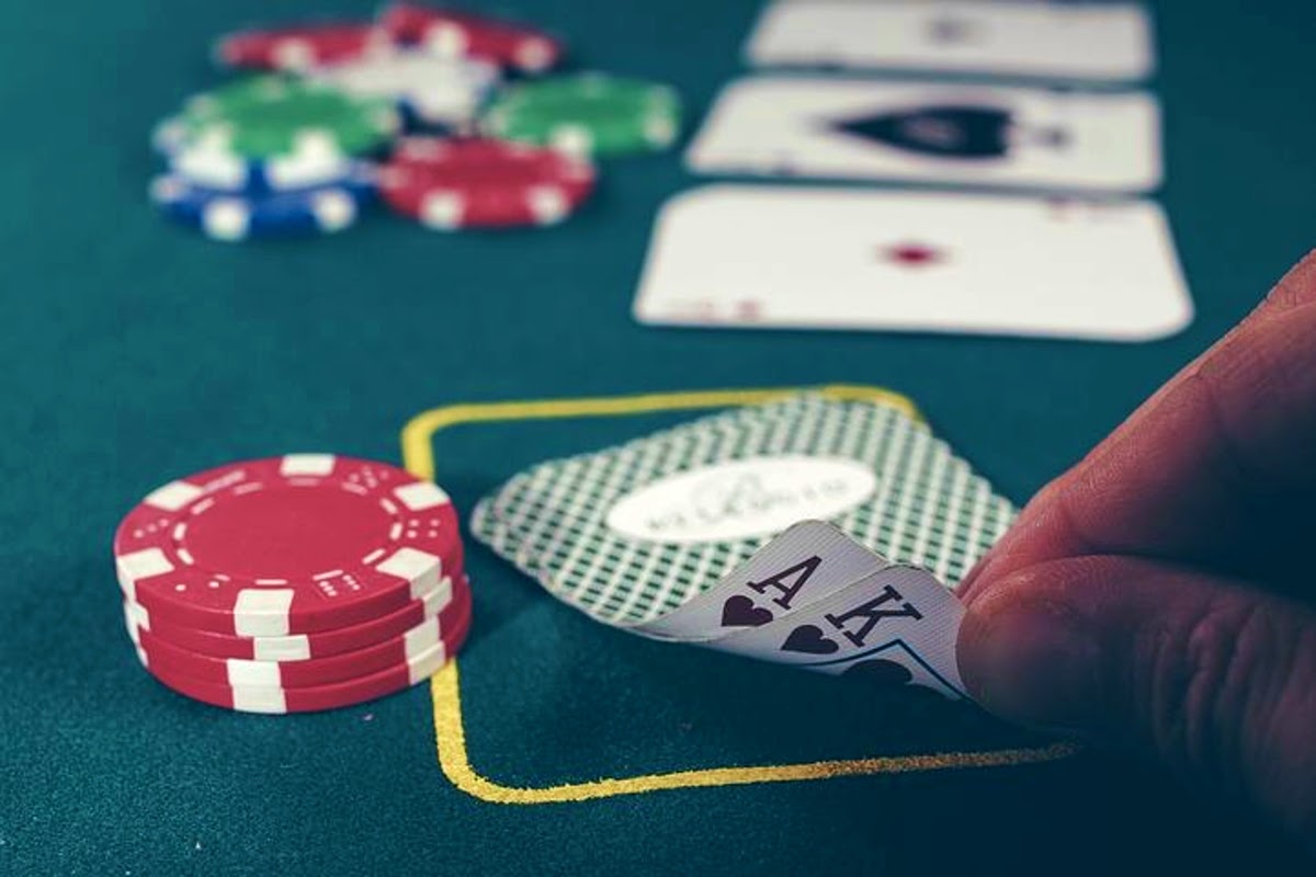 photo of a gambler with cards