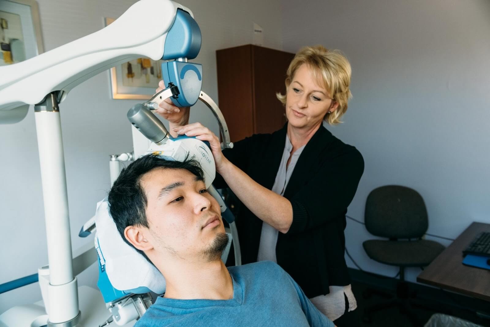 image of a man receiving TMS treatment