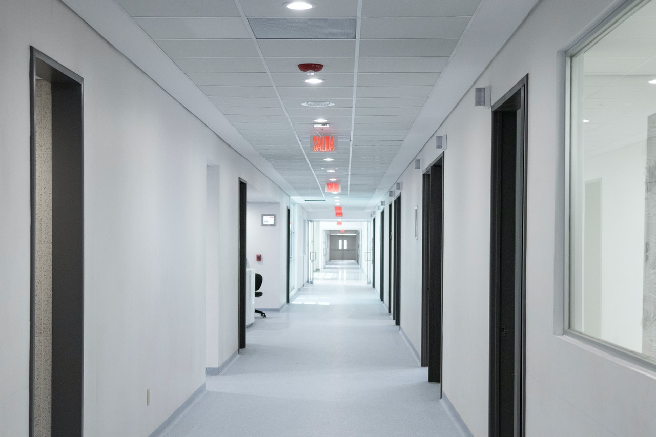 Empty white hallway in medical clinic