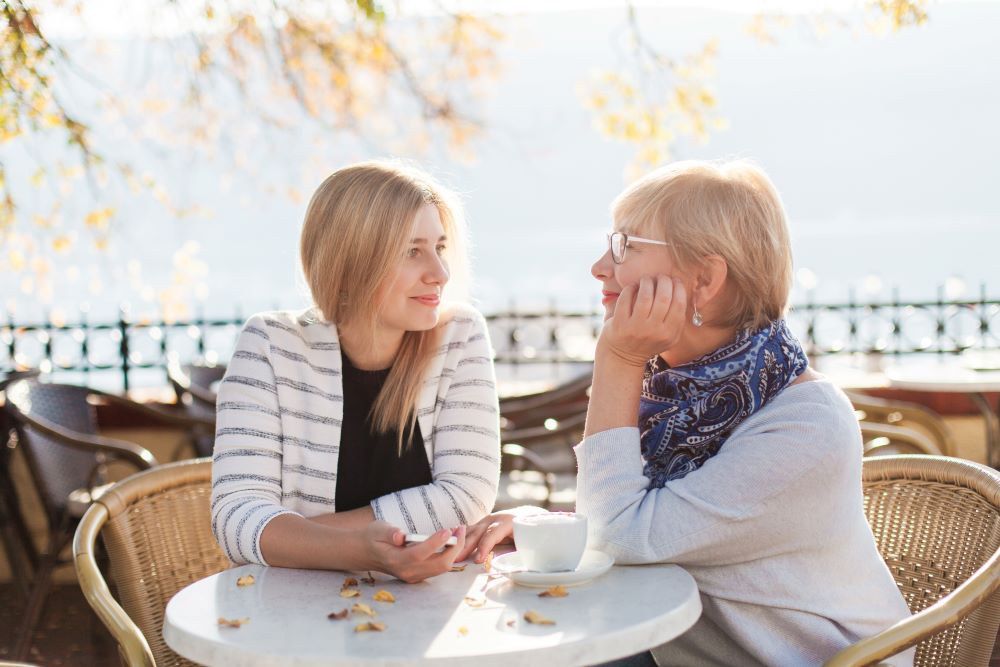 Two women discussing the question: what is life coaching