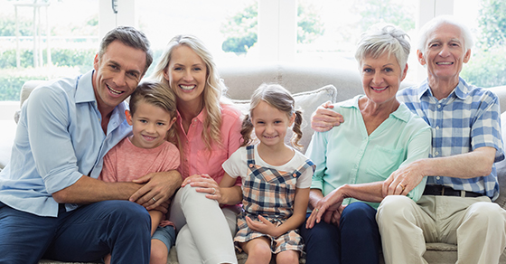 3 generations of a family sitting on a couch