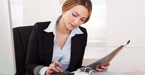 business woman using calculator