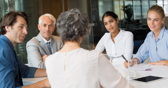 business people around conference table