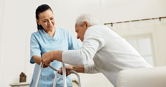 healthcare working helping senior patient