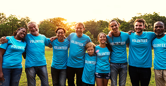 group of volunteers wearing matching blue tshirts