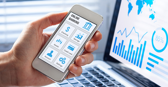 hand holding phone with online banking screen