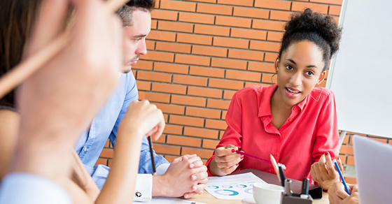 coworkers talking at table