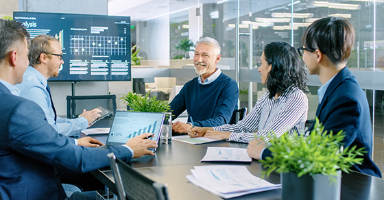 business people sitting around a conference table