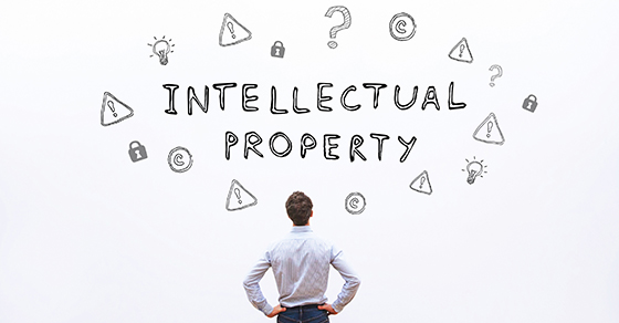 man looking at "intellectual property" and symbols