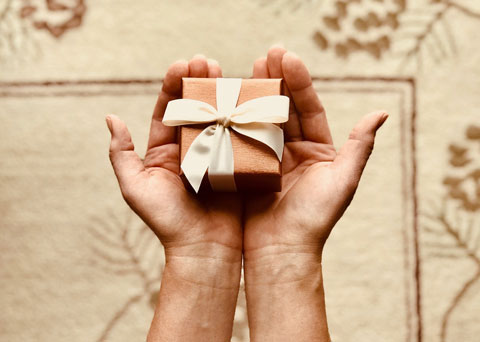 hands holding small gift