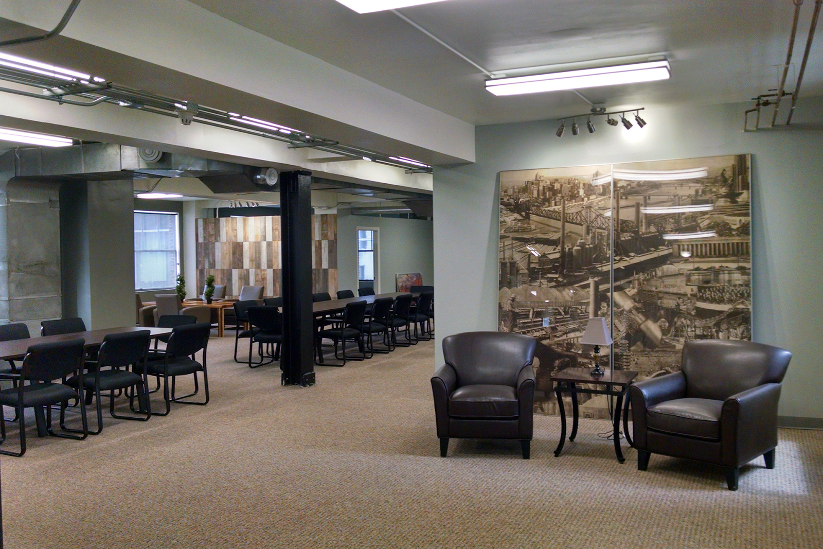 club level coworking space interior with plenty of tables and chairs