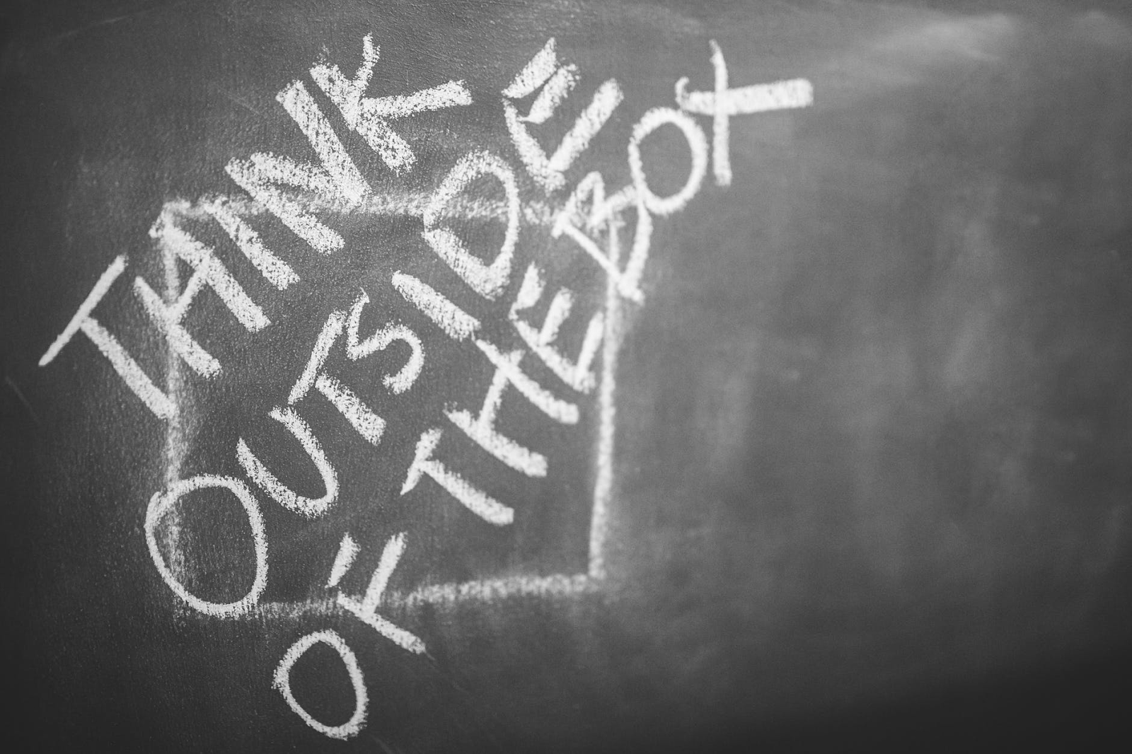 chalkboard that reads "think outside the box"