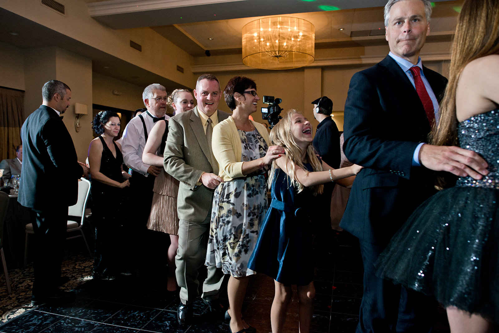 coworkers doing a conga line