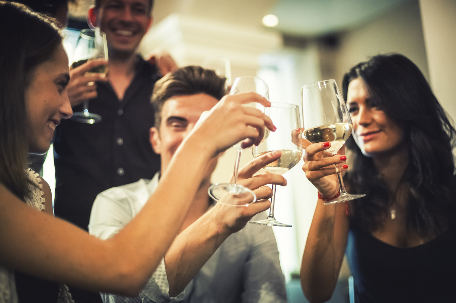 coworkers cheering with wine
