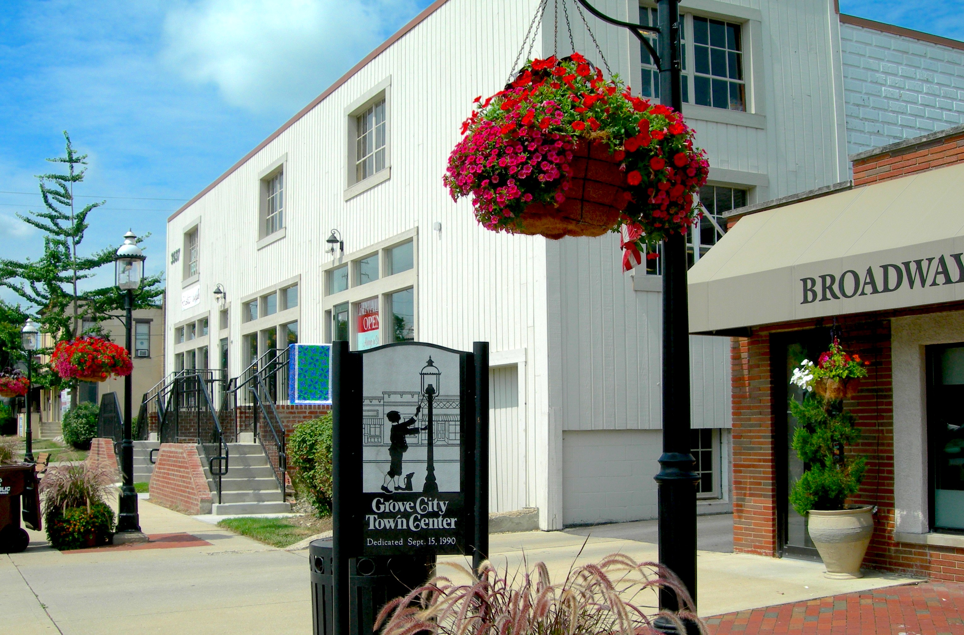 the heart of grove city with grove city town center sign