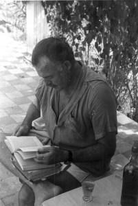 EH 3963 Ernest Hemingway reading outside at Finca Vigia in Cuba. Please credit "Ernest Hemingway Collection/John F. Kennedy Presidential Library and Museum, Boston"