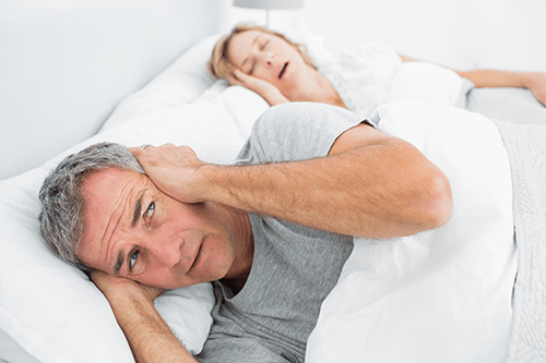 Couples suffering with sleep deprivation due to sleep apnea.