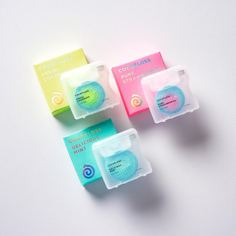 A picture of Fresh Coconut, Pure Strawberries, and Delicious Mint Cocofloss.