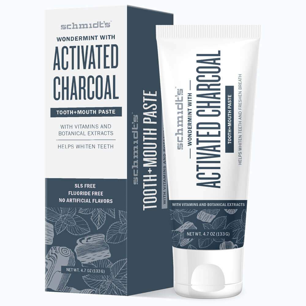 A blue and white box and a tube of Schmidt's Wondermint Activated Charcoal toothpaste are pictured here.