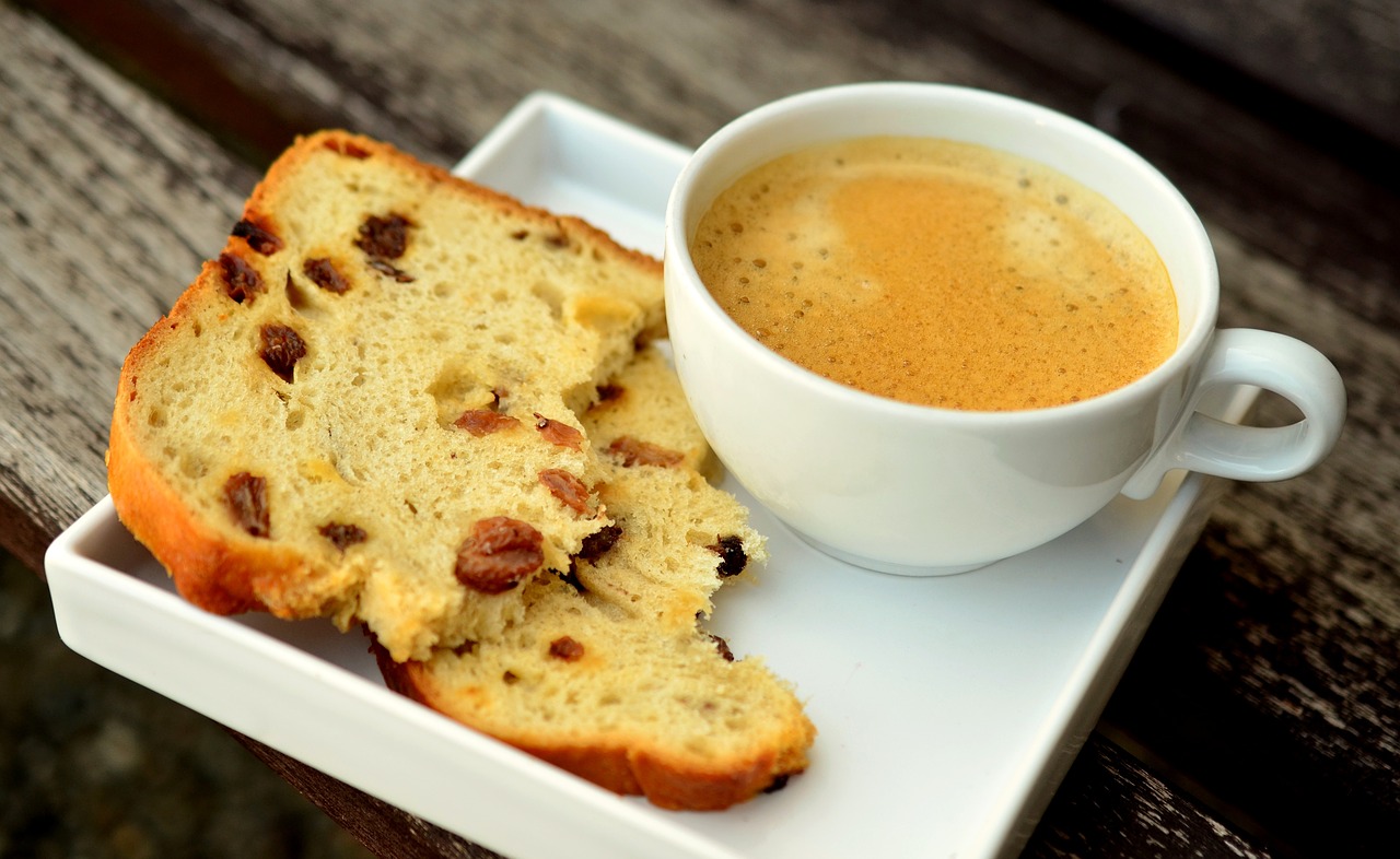 Coffee and bread on a ceramic plate