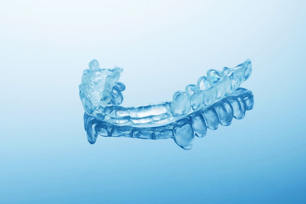 A blue hard-plastic mouth splint for Bruxism.