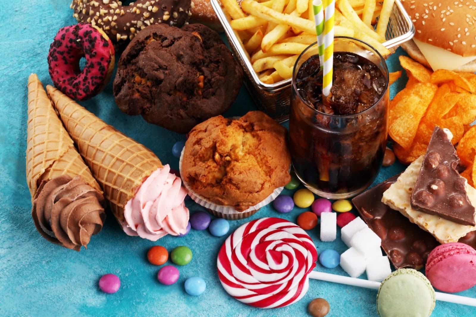 Unhealthy foods like muffins, hard candy, fries, and carbonated drinks.