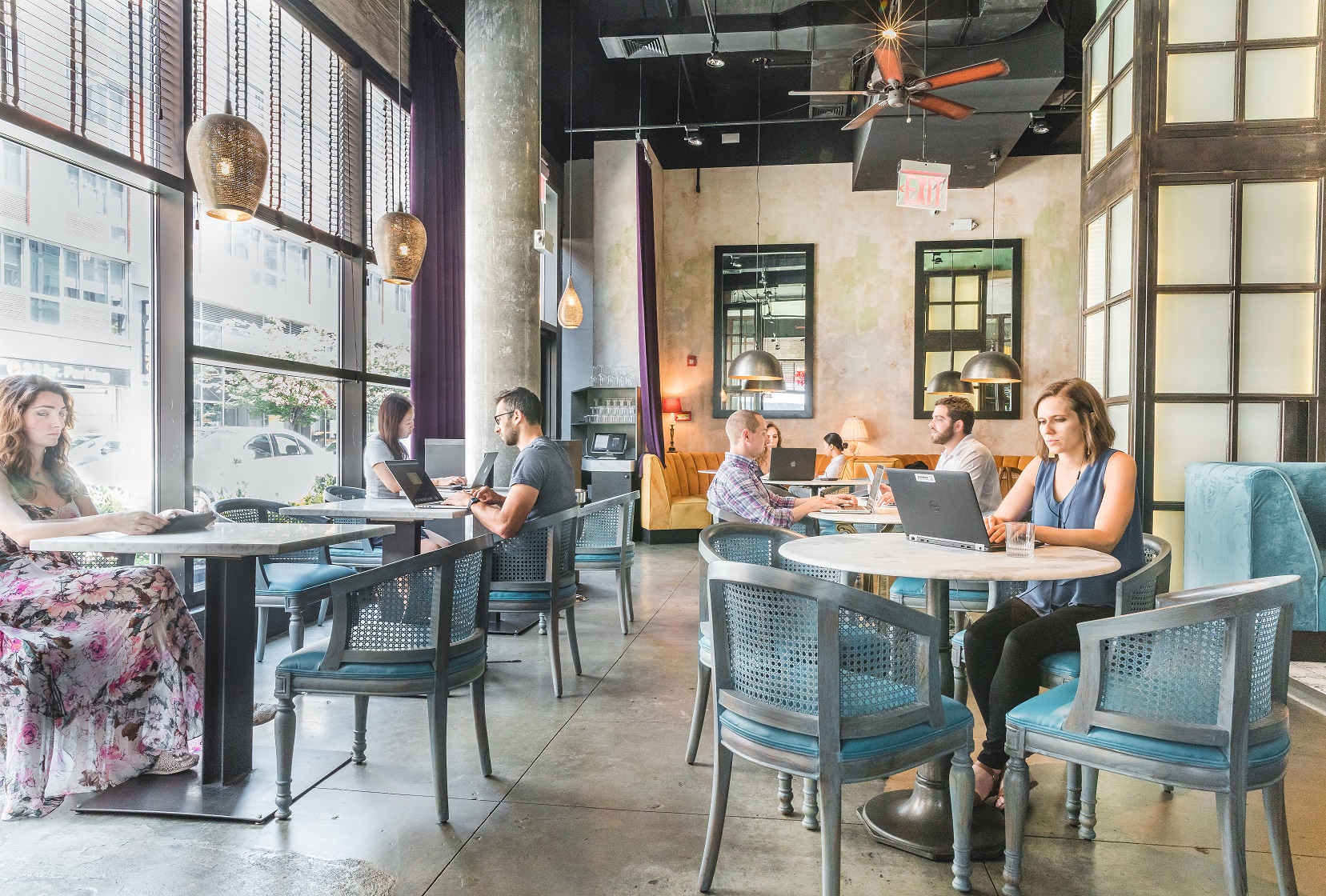 People working in a third space at a restaurant in NYC - KettleSpace flexible space options for your teams