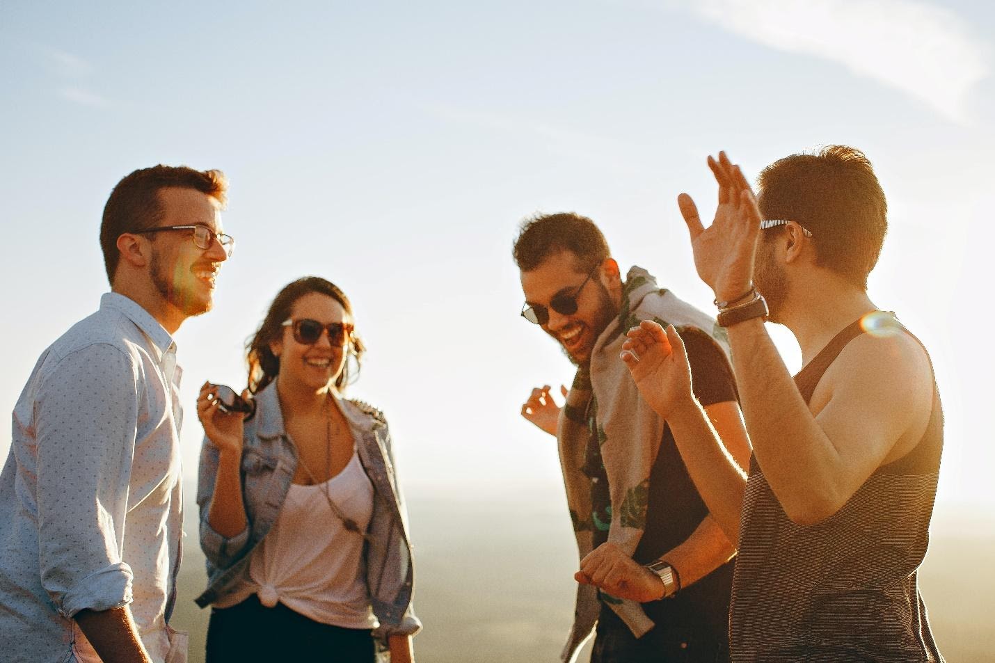 A group of people standing togetherDescription automatically generated with low confidence
