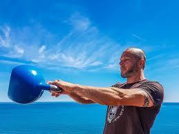 Man swinging a kettlebell