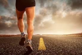 Man running down a highway