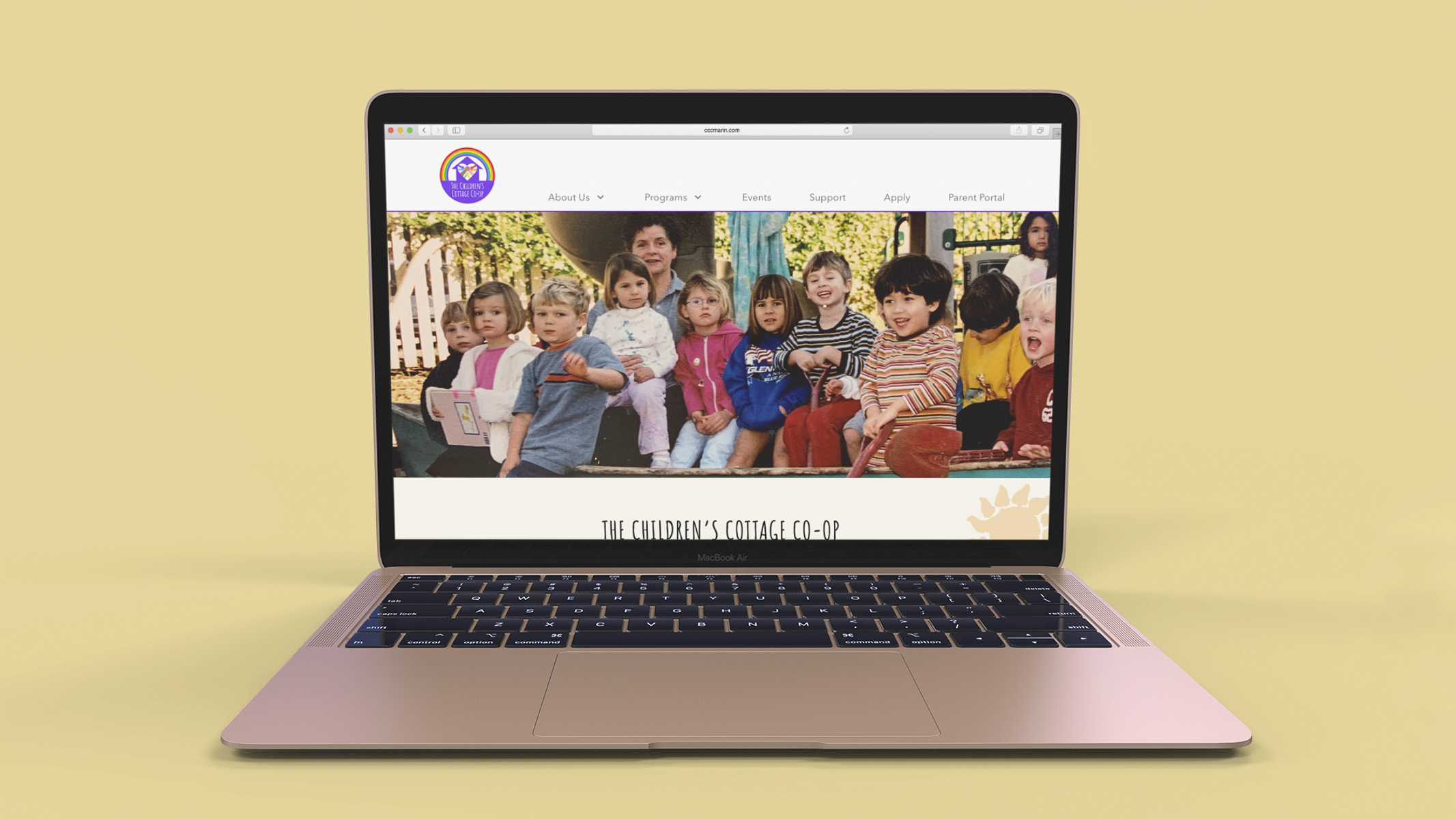 A mockup showing the new Children's Cottage website on a Macbook Pro.