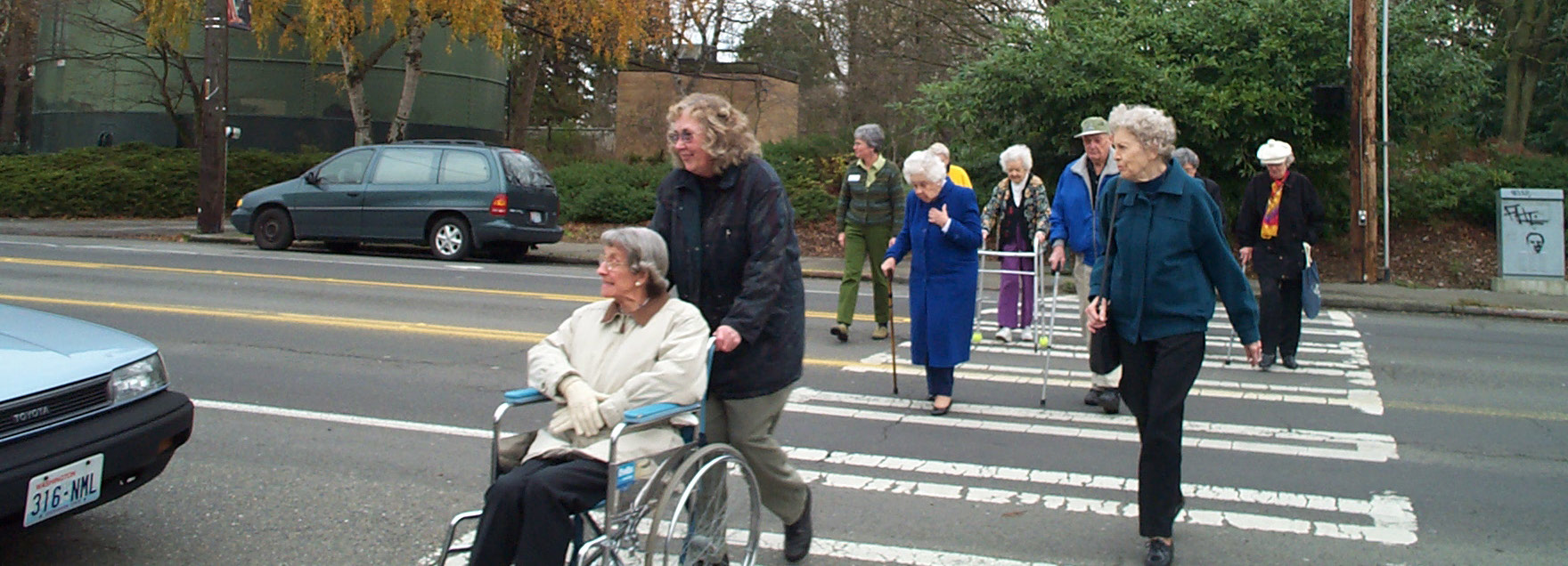 group of seniors crossing the street