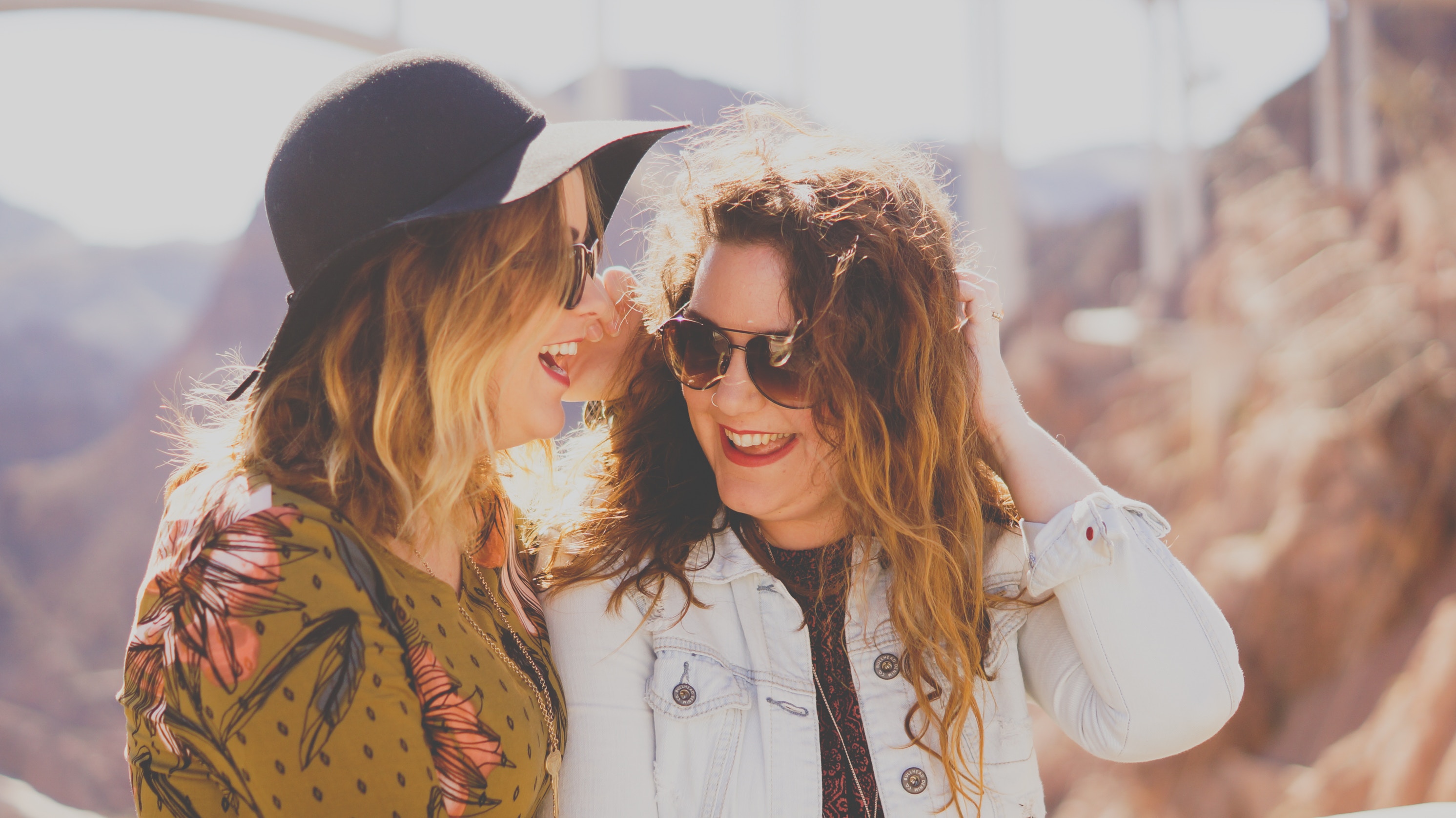two happy women laughing together