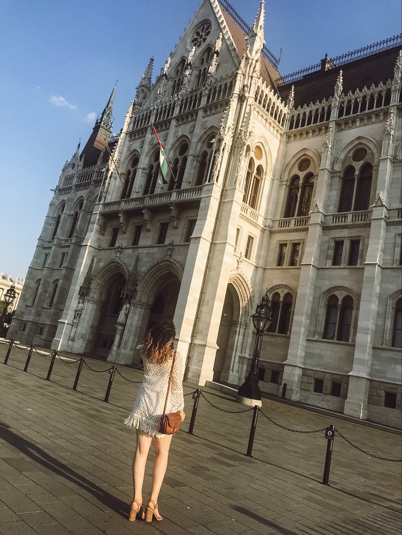 Woman in Budapest lookng at the gothic architecture