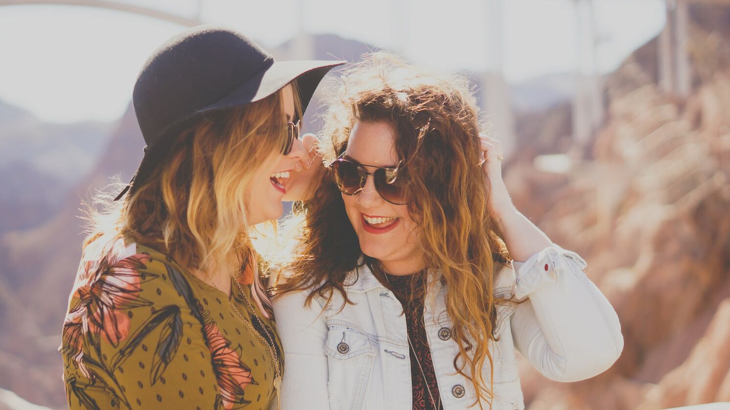 two happy women laughing together on a vacation