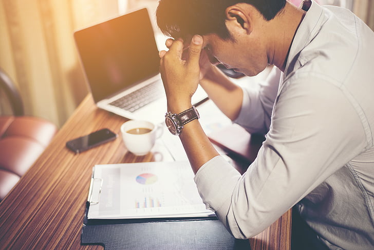man stressed at work needing burnout treatment