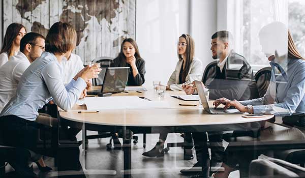 Digital Transformation Consultant - People working collaboratively on a laptop computer
