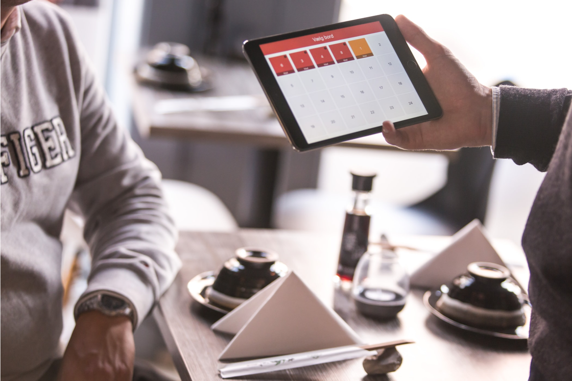 man showing tablet's screen