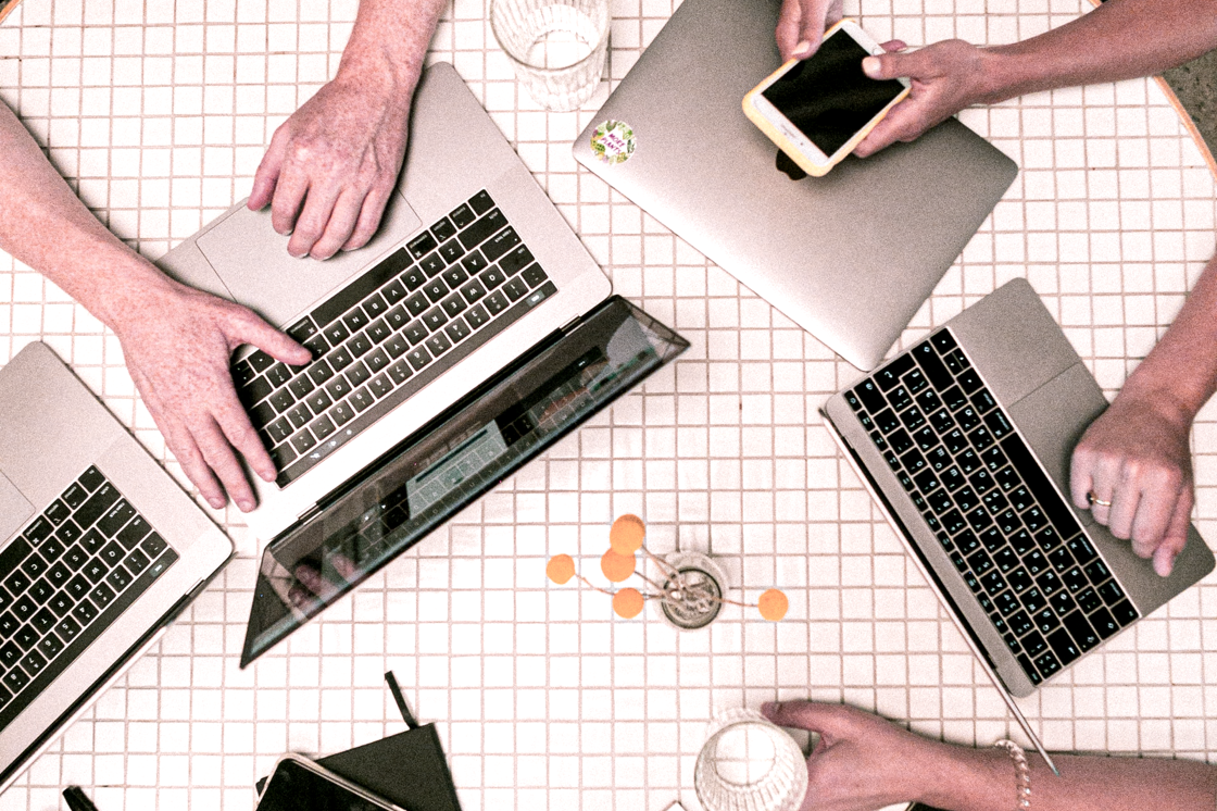 group of people working with their laptop