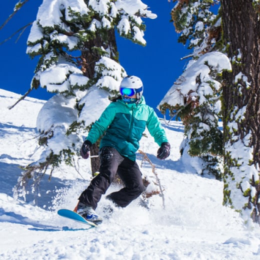 man skiing in white powder