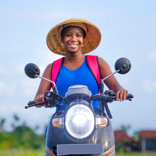 woman riding scooter in asia