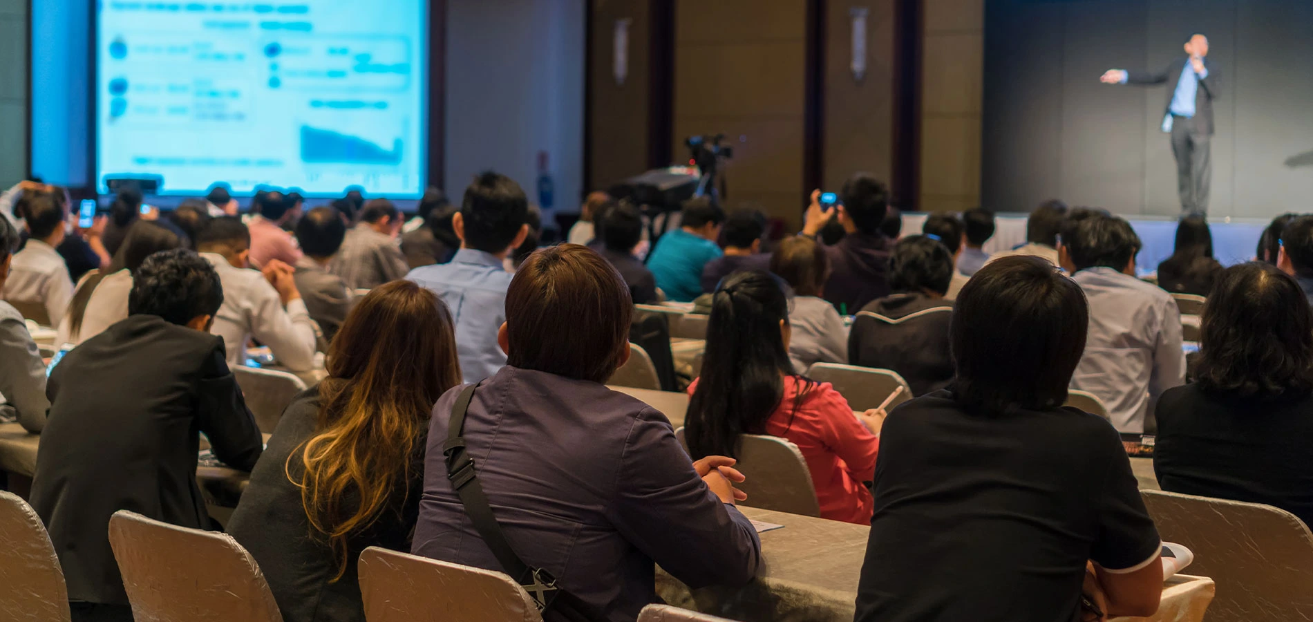 Audiences listening to the speakers at stage